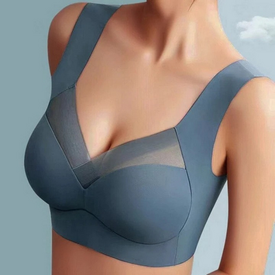 Szürkéskék színű varrásmentes melltartó modellen, V-alakú átlátszó hálós betéttel és széles vállpántokkal, oldalról-elölről fotózva. 1