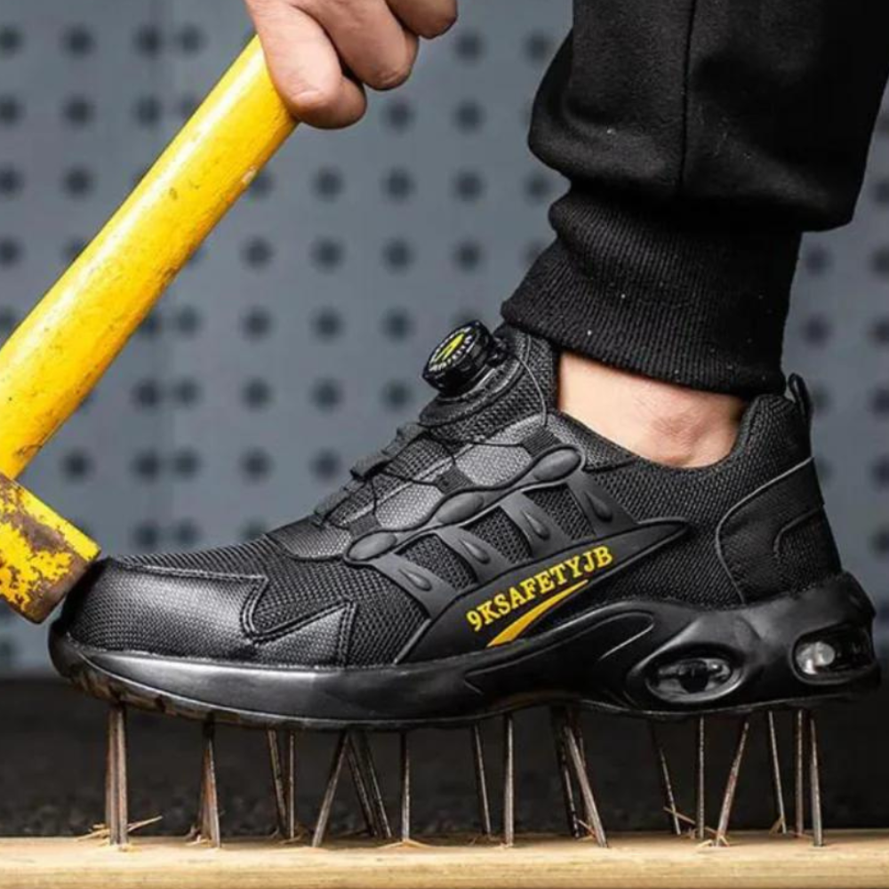 Schwarzer Sicherheitsschuh, durchstichfest, robust, mit gelbem Hammer getestet.