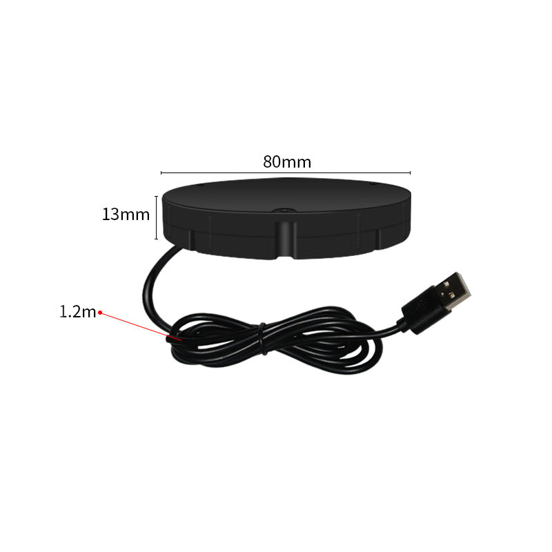 A fekete töltőkorong méretezett képe, mellette az 1,2 méteres, USB-csatlakozós kábel feltekerve. 9