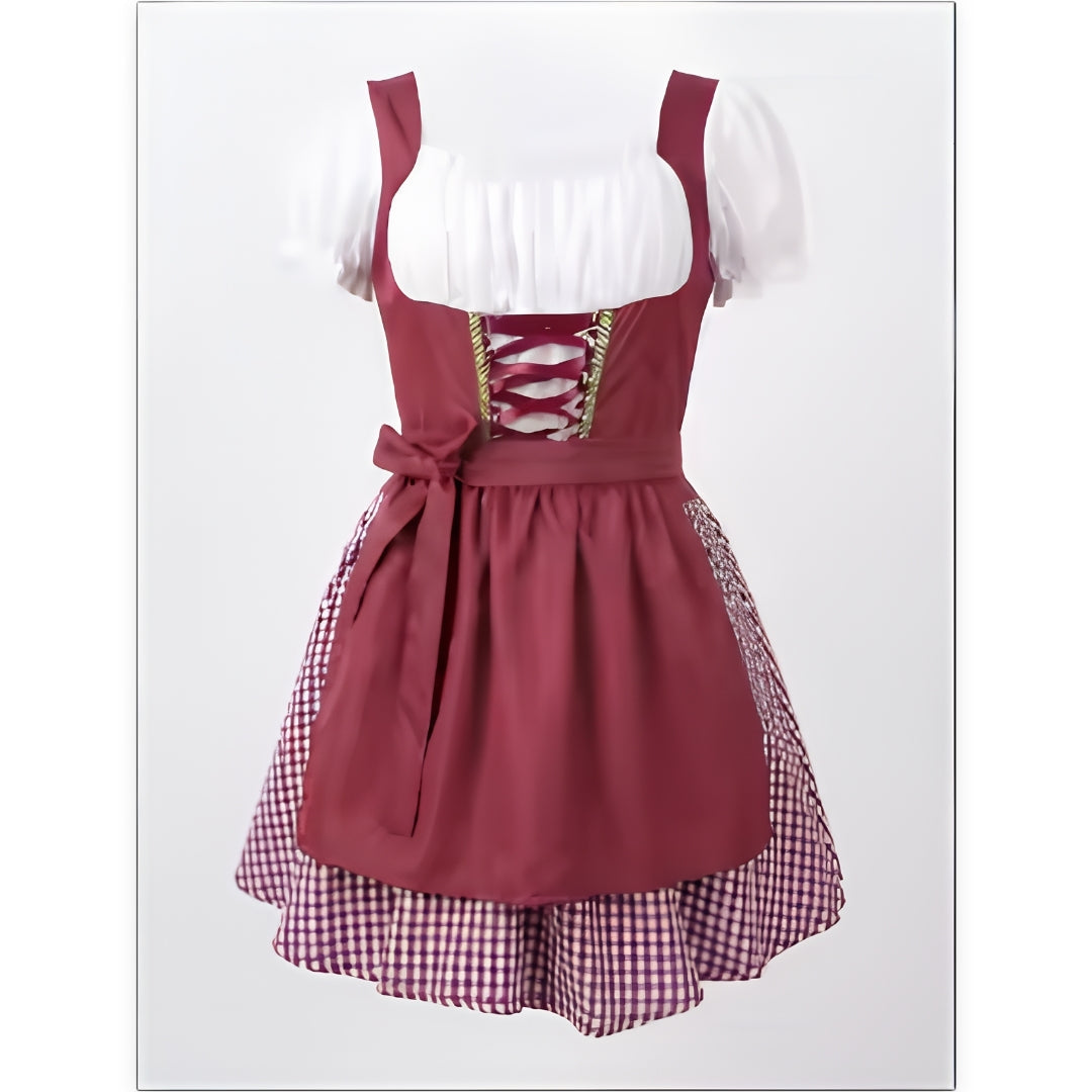 Bordó dirndl ruha elölnézetből, fehér puffos ujjú blúzzal, fűzős mellrésszel, masnis kötényrésszel és kockás alsószoknyával. 1