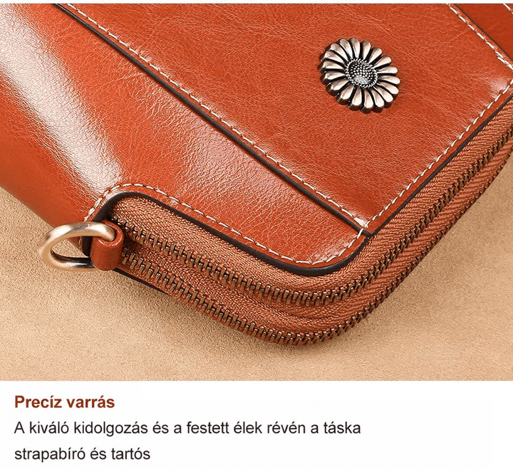 Közeli kép a táska sarkáról: finom varrás, festett él, cipzár és virágdísz 16