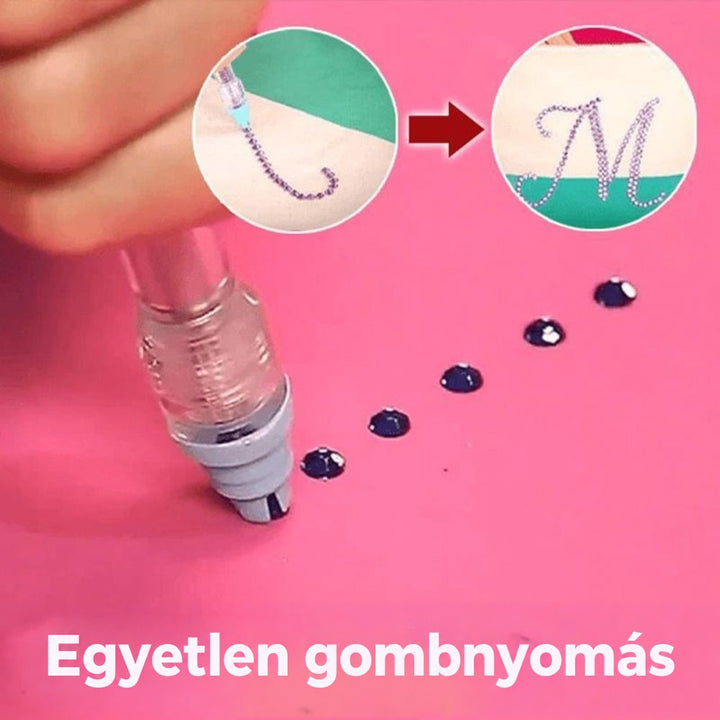 Gombnyomásra a toll sötét strasszköveket helyez rózsaszín felületre, beszúrt képen kirakott M betűs minta 3