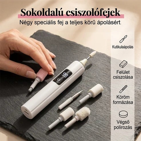 Kéz a készülék cserélhető csiszolófejeit rendezi egy sötét kőlapon, a fejek szétszórva hevernek 3