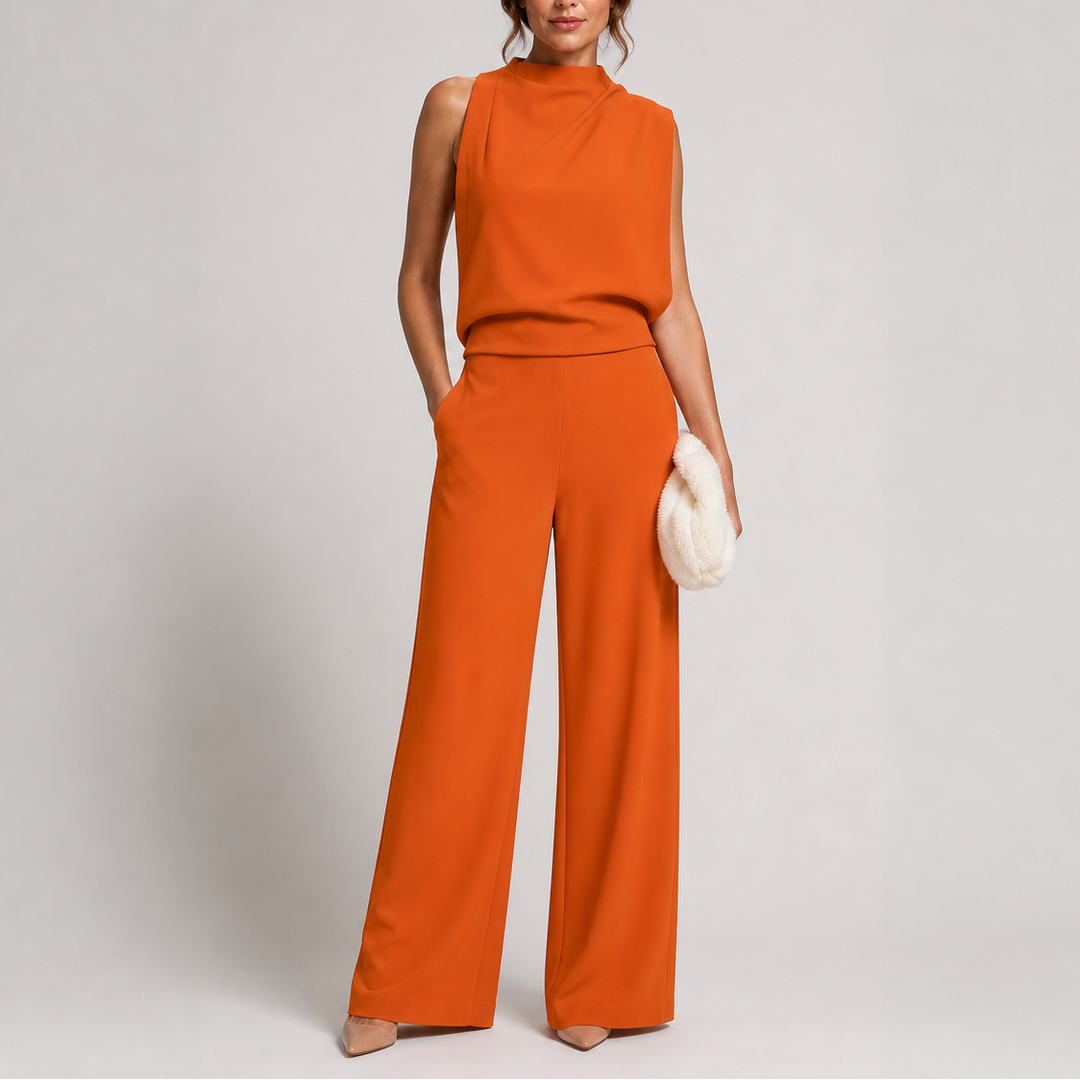 Narancsszínű, ráncolt nyakú jumpsuit modellen, bő szárral, testszínű cipővel és fehér szőrmés táskával 5