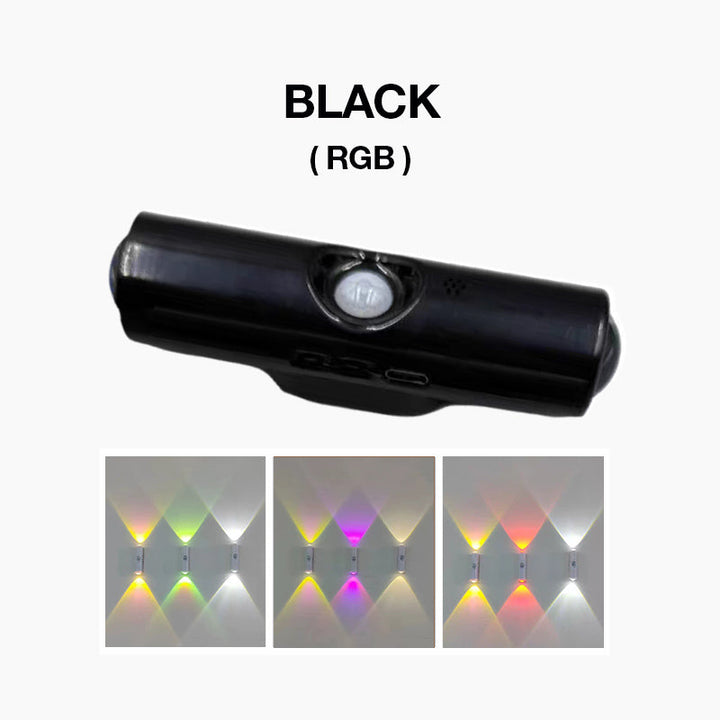Fekete hengeres lámpa közelről, alatta három falra vetített, színes RGB fényhatás 4